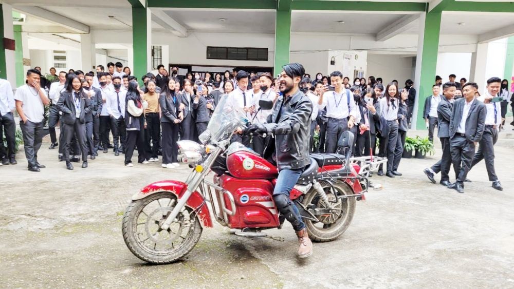 Philem Rohan Singh demonstrate electric bike to students at Mount Olive College, Kohima on October 27. (Morung Photo)
